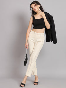 Regular fit mid waist off white trousers styled with a black crop top.