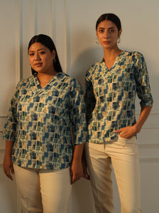 Regular fit blue and green printed V-neck top for women.