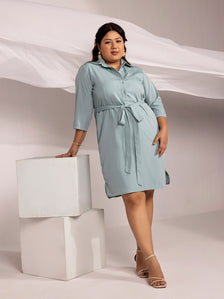 Light blue crepe collared dress with tie waist and elegant style.