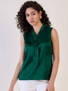 Green satin tie collar neck top worn by a model.