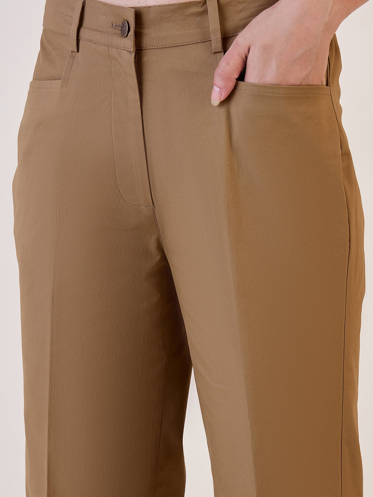 Brown straight fit mid waist trouser with pockets for women.