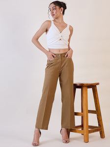 Brown straight fit mid waist trouser styled with a white crop top.