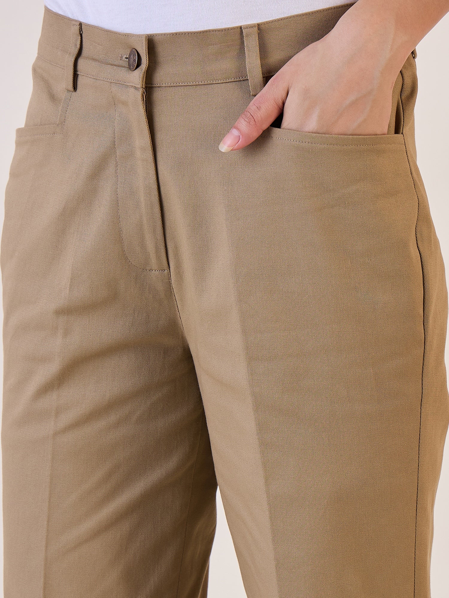 Straight fit mid waist trouser in camel brown color.