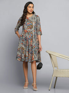 Printed multicolor flare dress worn by model, stylish and vibrant design.